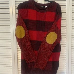 Plaid sweater with elbow patches.